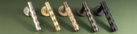 This is an image showing the Alexander & Wilks Spitfire Diamond Cut Lever on Round Rose in various finishes