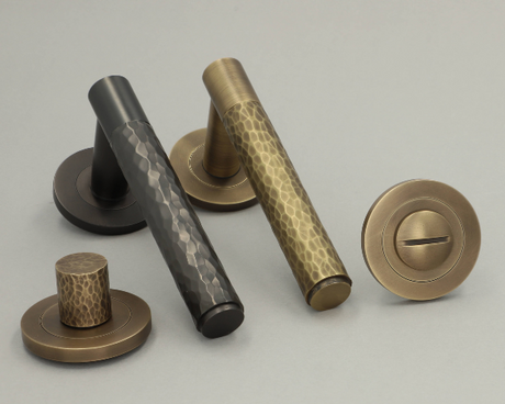 This is an image showing Alexander & Wilks - Door Handles on a Round Rose