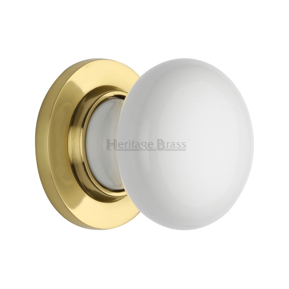 This is an image of a Heritage Brass - White Knob with Polished Brass base, 5010-pb that is available to order from T.H Wiggans Ironmongery in Kendal.