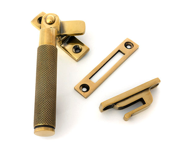 This is an image of From The Anvil - Aged Brass Locking Brompton Fastener – LH available to order from T.H. Wiggans Ironmongery in Kendal.