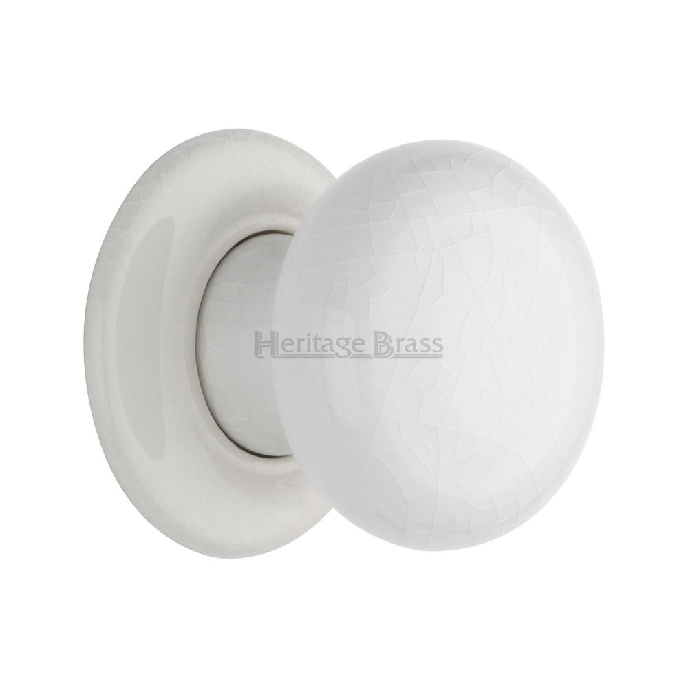 This is an image of a Heritage Brass - White Crackle Knob with Porcelain base, 7010-pr that is available to order from T.H Wiggans Ironmongery in Kendal.