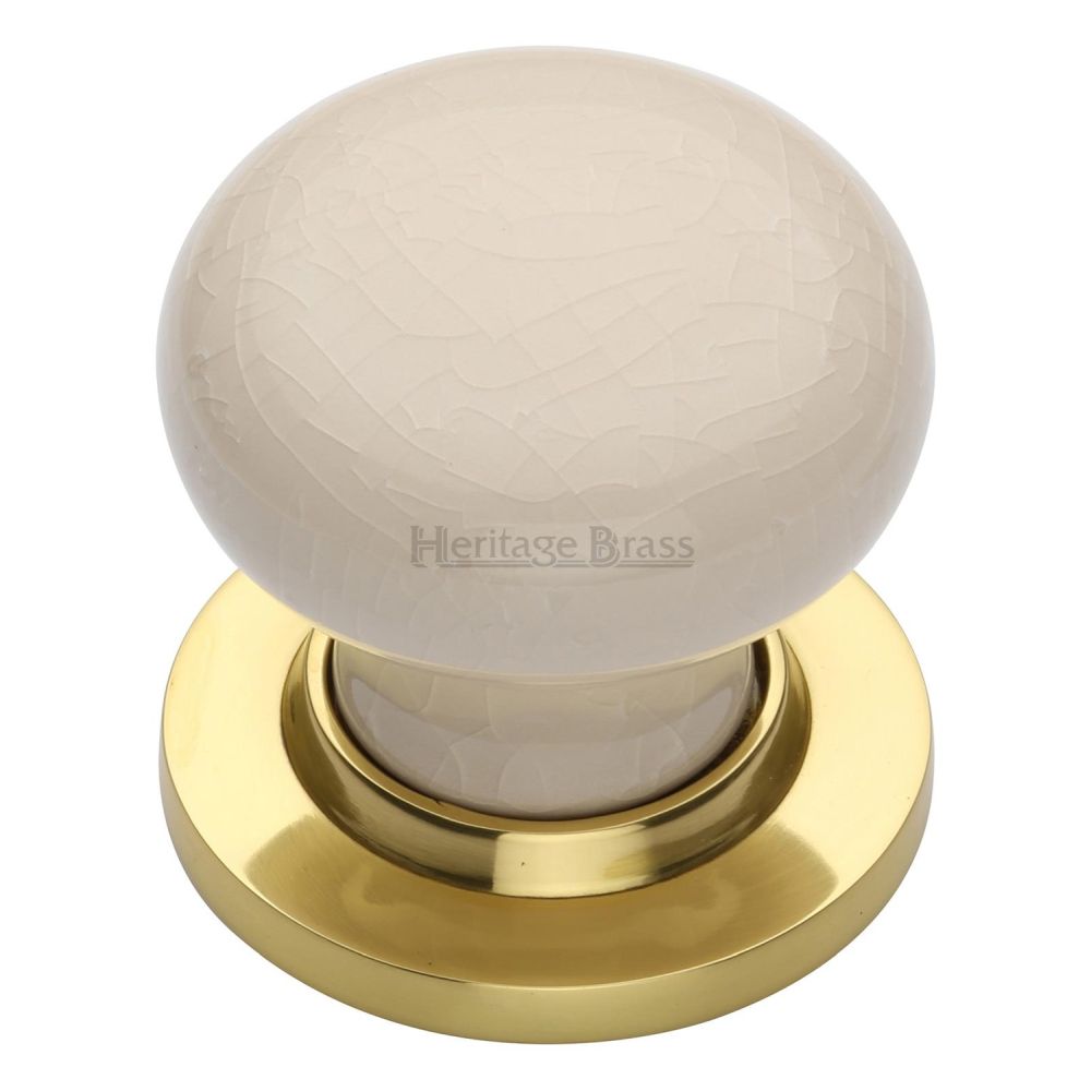 This is an image of a Heritage Brass - Cream Crackle Knob with Polished Brass base, 8010-pb that is available to order from T.H Wiggans Ironmongery in Kendal.