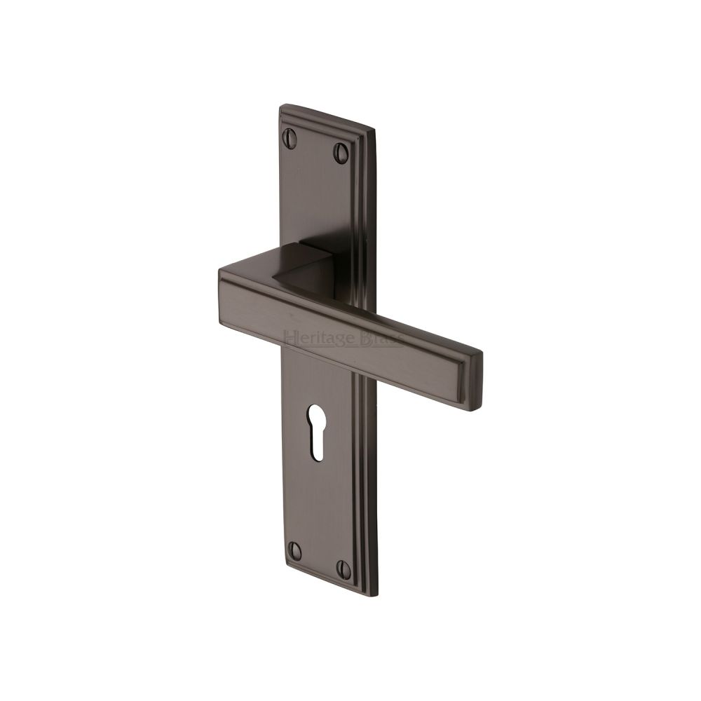 This is an image of a Heritage Brass - Door Handle Lever Lock Atlantis Design Matt Bronze Finish, atl5700-mb that is available to order from T.H Wiggans Ironmongery in Kendal.