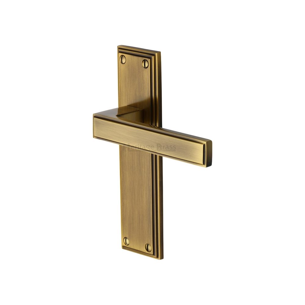 This is an image of a Heritage Brass - Door Handle Lever Latch Atlantis Design Antique Brass Finish, atl5710-at that is available to order from T.H Wiggans Ironmongery in Kendal.