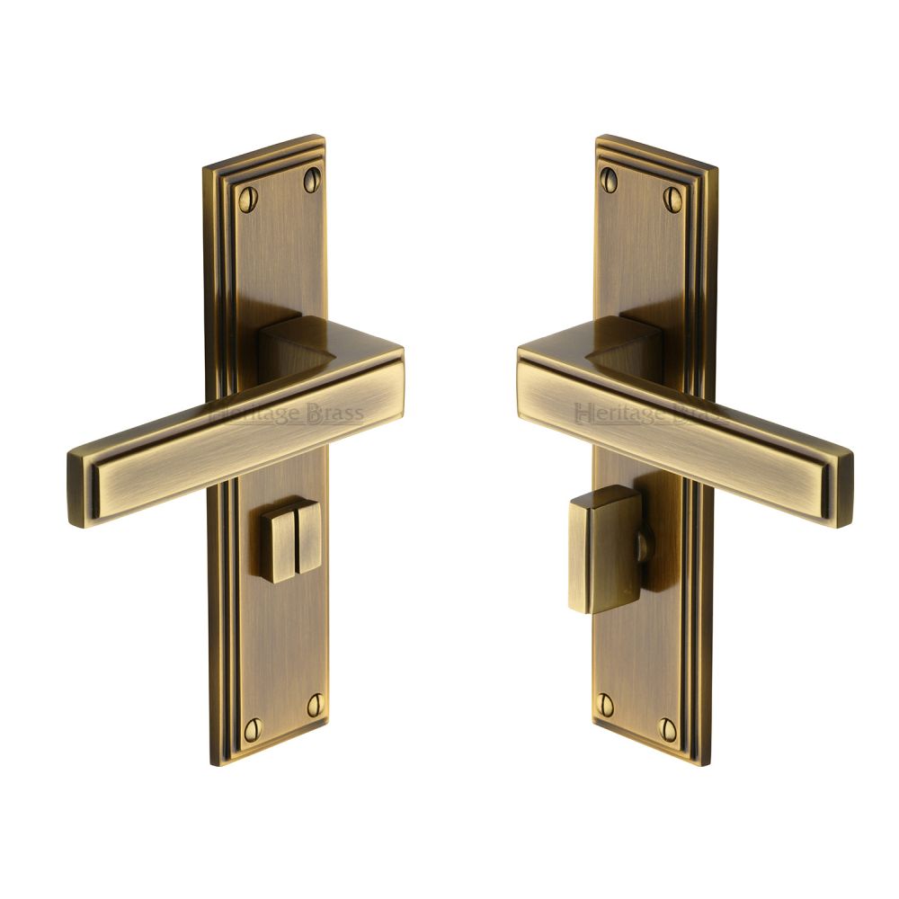 This is an image of a Heritage Brass - Door Handle for Bathroom Atlantis Design Antique Brass Finish, atl5730-at that is available to order from T.H Wiggans Ironmongery in Kendal.