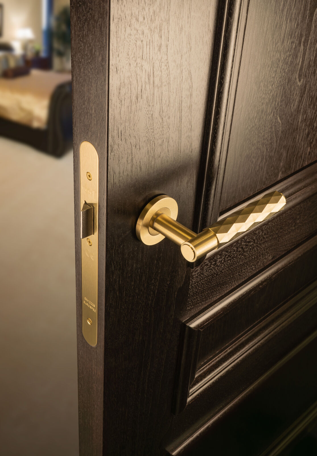 This is an image showing Alexander & Wilks Spitfire Diamond Cut Lever on Round Rose - Satin Brass PVD - aw226-SBPVD available to order from T.H. Wiggans Ironmongery in Kendal, quick delivery and discounted prices.