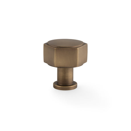 This is an image showing Alexander & Wilks - Vesper Hex Cabinet Knob - Antique Brass aw828-33-ab available to order from T.H. Wiggans Ironmongery in Kendal, quick delivery and discounted prices.