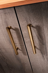 This is an image showing Alexander & Wilks - Vesper Hex T - Bar Cabinet Pull - Antique Brass - 128mm C/C aw830-128-ab available to order from T.H. Wiggans Ironmongery in Kendal, quick delivery and discounted prices.