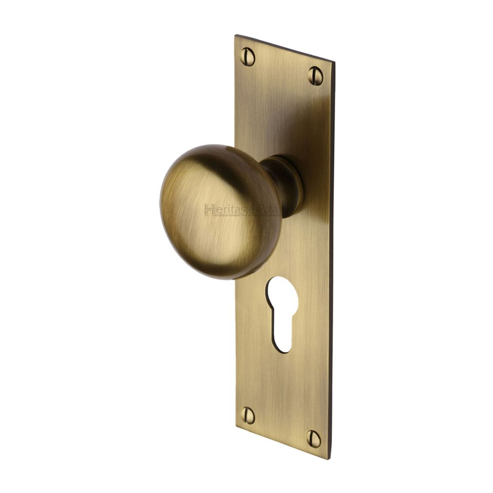 This is an image of a Heritage Brass - Mortice Knob on Euro Profile Plate Balmoral Design Antique Brass F, bal8548-at that is available to order from T.H Wiggans Ironmongery in Kendal.