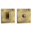 This is an image of a Heritage Brass - Square Low profile Thumbturn & Emergency Release Antique Brass Fin, bau1555-at that is available to order from T.H Wiggans Ironmongery in Kendal.