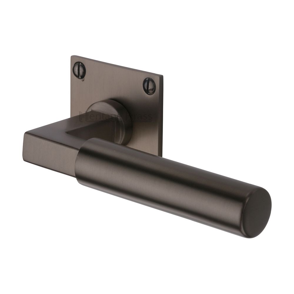 This is an image of a Heritage Brass - Door Handle Lever Latch on Square Rose Bauhaus Design Matt Bron, bau1926-mb that is available to order from T.H Wiggans Ironmongery in Kendal.