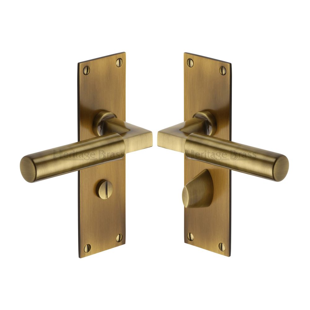This is an image of a Heritage Brass - Door Handle for Bathroom Bauhaus Design Antique Brass Finish, bau7330-at that is available to order from T.H Wiggans Ironmongery in Kendal.