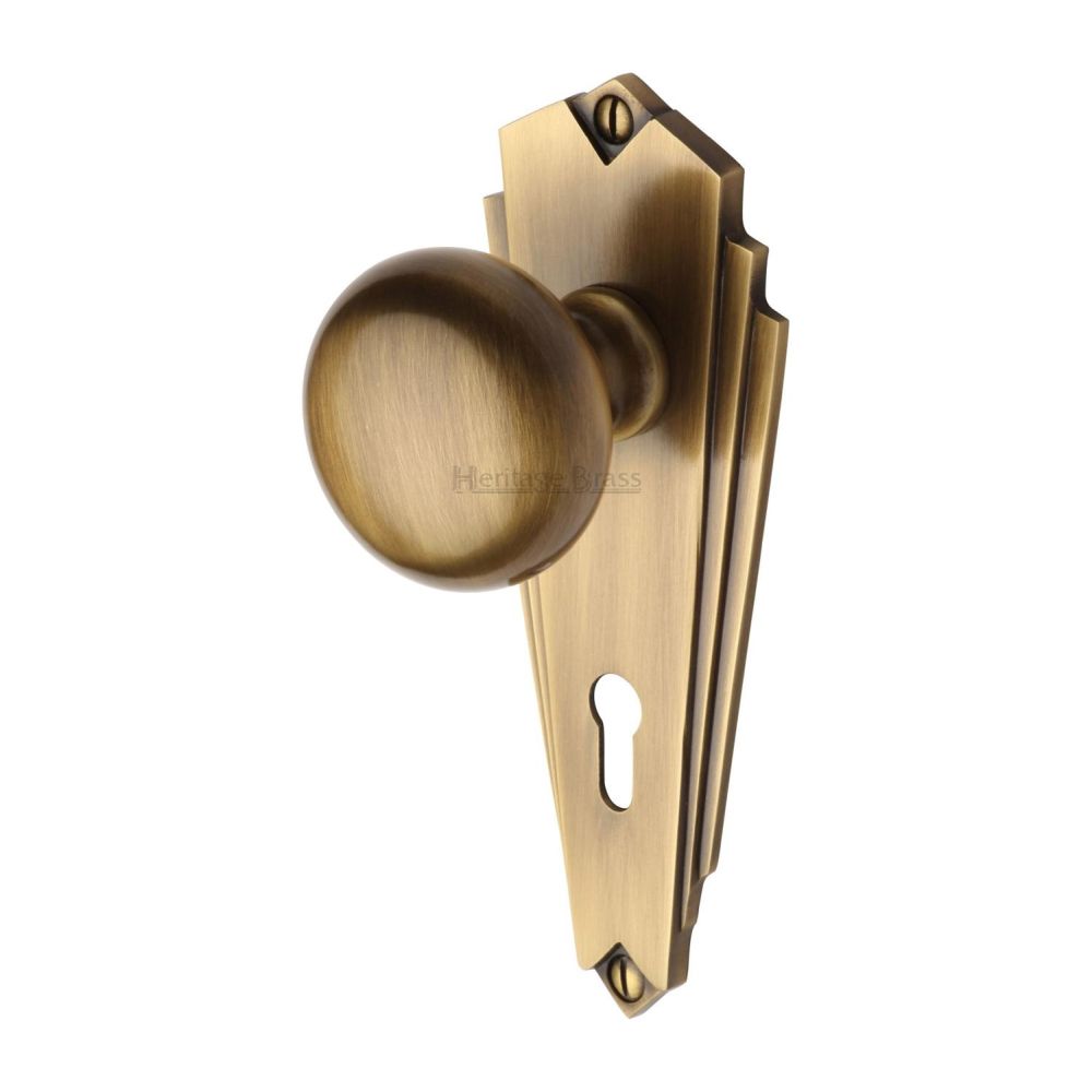 This is an image of a Heritage Brass - Mortice Knob on Lock Plate Broadway Design Antique Brass Finish, br1800-at that is available to order from T.H Wiggans Ironmongery in Kendal.