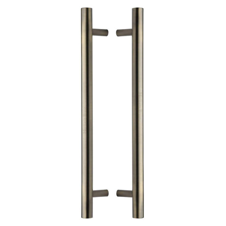 This is an image of a Heritage Brass - Back to Back Door Pull Handle Bar Design 457mm Antique Brass Finish, btb1361-457-at that is available to order from T.H Wiggans Ironmongery in Kendal.