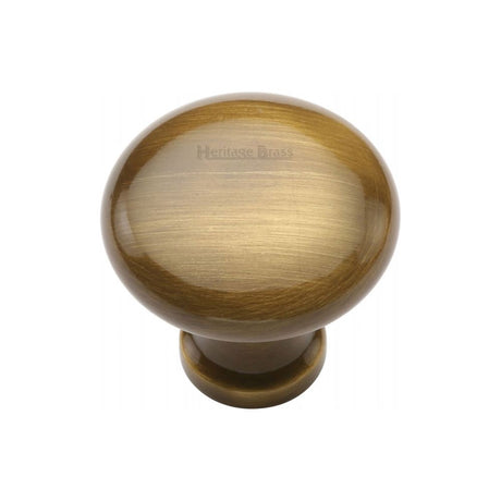 This is an image of a Heritage Brass - Cabinet Knob Victorian Round Design 32mm Antique Brass Finish, c113-32-at that is available to order from T.H Wiggans Ironmongery in Kendal.