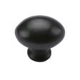 This is an image of a Heritage Brass - Cabinet Knob Victorian Oval Design 32mm Matt Black Finish, c114-32-bkmt that is available to order from T.H Wiggans Ironmongery in Kendal.