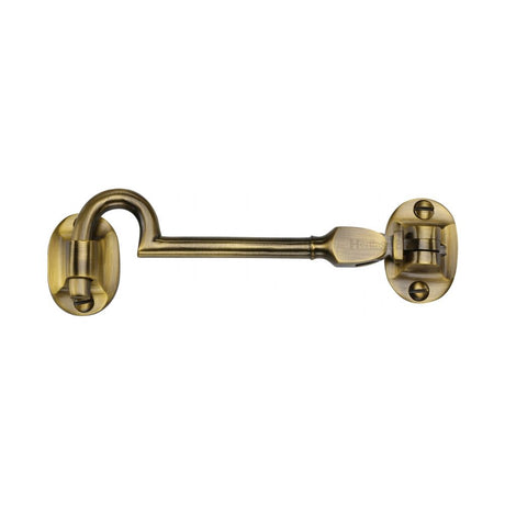 This is an image of a Heritage Brass - Cabin Hook 4" Antique Brass Finish, c1530-4-at that is available to order from T.H Wiggans Ironmongery in Kendal.