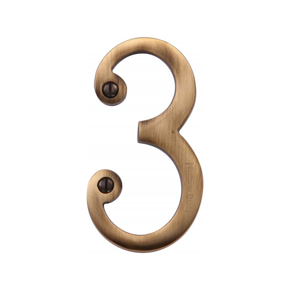 This is an image of a Heritage Brass - Numeral 3 Face Fix 76mm (3") Antique Brass Finish, c1560-3-at that is available to order from T.H Wiggans Ironmongery in Kendal.