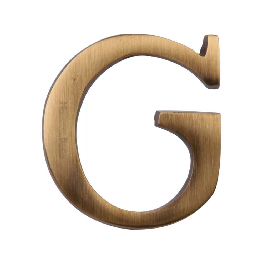 This is an image of a Heritage Brass - Alphabet G Pin Fix 51mm (2") Antique Brass Finish, c1565-2-g-at that is available to order from T.H Wiggans Ironmongery in Kendal.