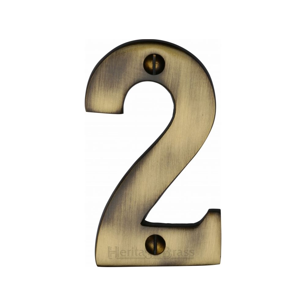 This is an image of a Heritage Brass - Numeral 2 Face Fix 76mm (3") Antique Brass Finish, c1566-2-at that is available to order from T.H Wiggans Ironmongery in Kendal.