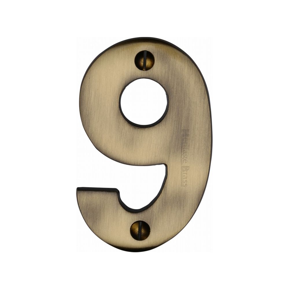 This is an image of a Heritage Brass - Numeral 9 Face Fix 76mm (3") Antique Brass Finish, c1566-9-at that is available to order from T.H Wiggans Ironmongery in Kendal.