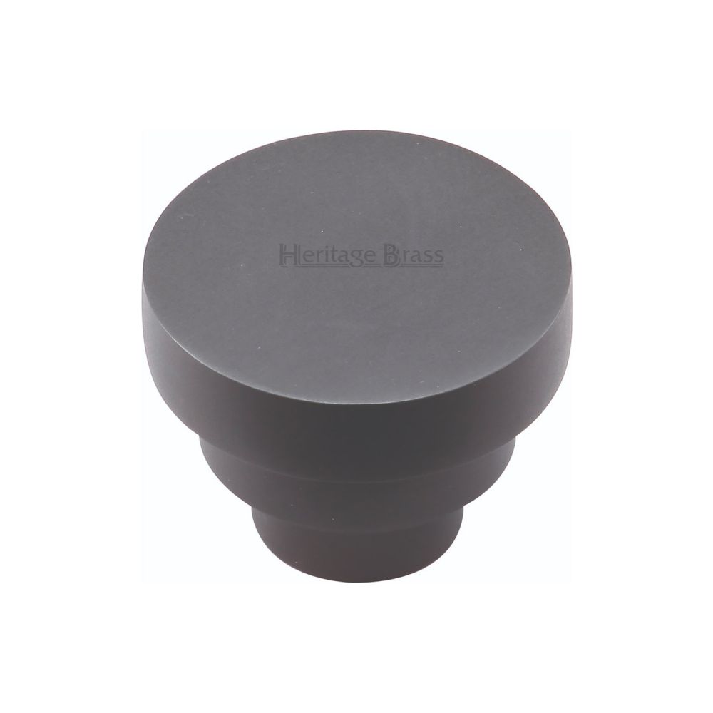 This is an image of a Heritage Brass - Cabinet Knob Round Stepped Design 32mm Matt Black Finish, c3624-32-bkmt that is available to order from T.H Wiggans Ironmongery in Kendal.