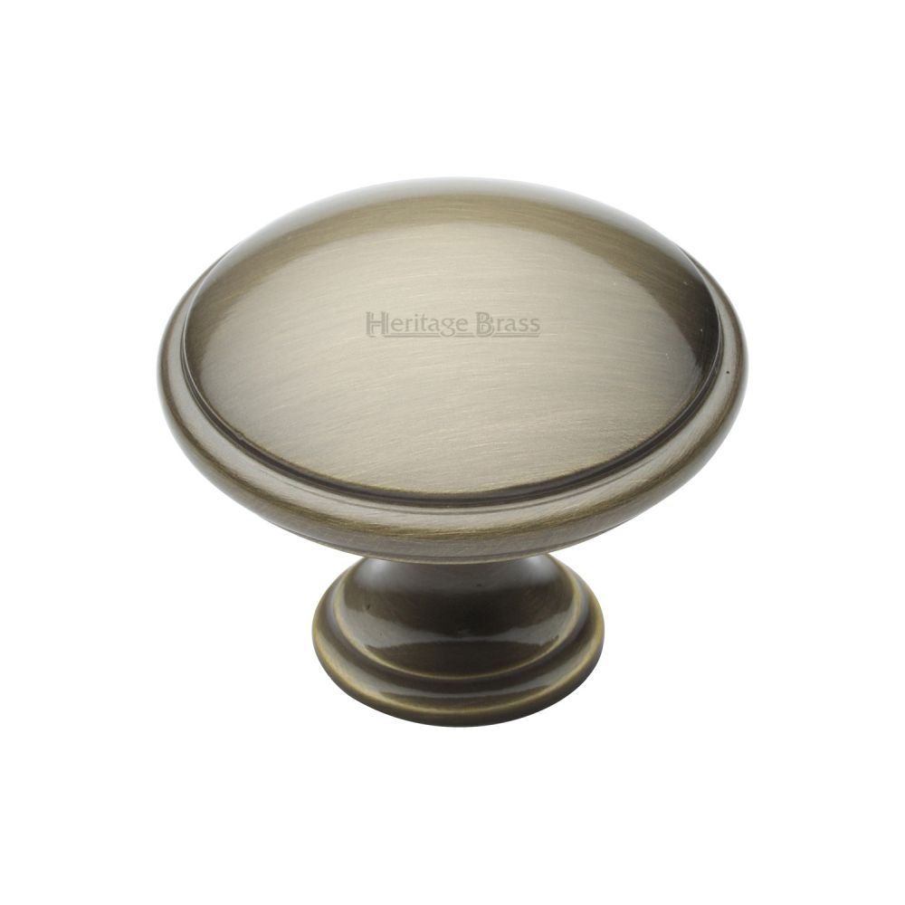 This is an image of a Heritage Brass - Cabinet Knob Domed Design 38mm Antique Brass Finish, c3950-38-at that is available to order from T.H Wiggans Ironmongery in Kendal.