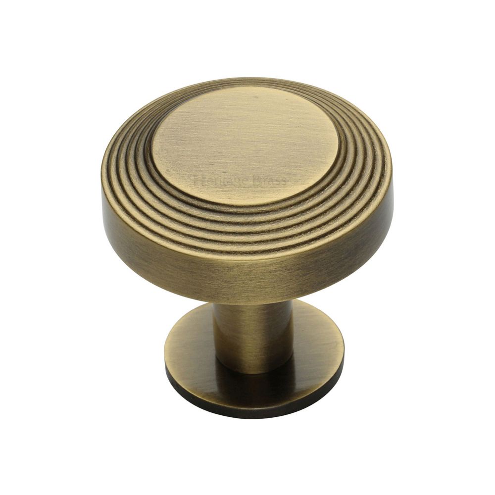 This is an image of a Heritage Brass - Cabinet Knob Ridge Design with Rose 32mm Antique Brass Finish, c3958-32-at that is available to order from T.H Wiggans Ironmongery in Kendal.