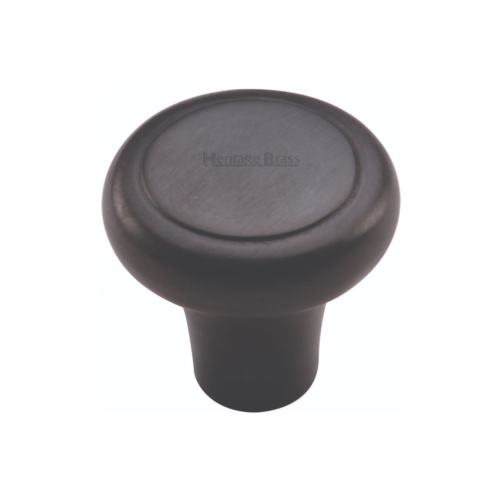 This is an image of a Heritage Brass - Cabinet Knob Round Edge Design 32mm Matt Black Finish, c3990-32-bkmt that is available to order from T.H Wiggans Ironmongery in Kendal.