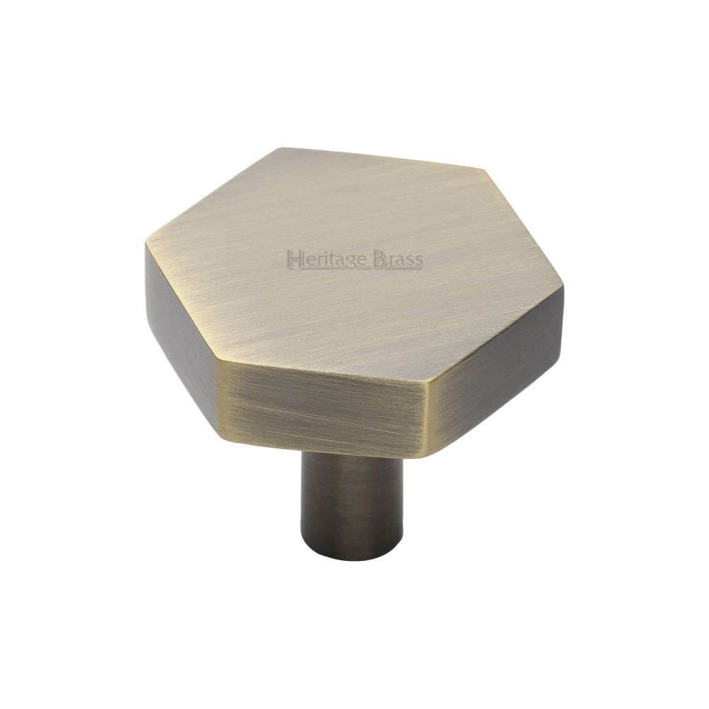 This is an image of a Heritage Brass - Cabinet Knob Hexagon Design 32mm Antique Brass Finish, c4344-32-at that is available to order from T.H Wiggans Ironmongery in Kendal.