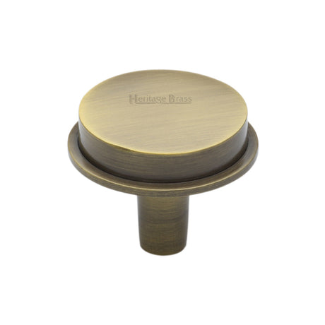 This is an image of a Heritage Brass - Cabinet Knob Flat Top Design 32mm Antique Brass finish, c4592-32-at that is available to order from T.H Wiggans Ironmongery in Kendal.