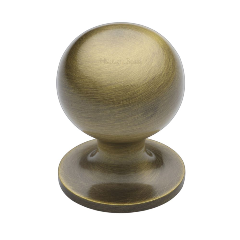 This is an image of a Heritage Brass - Cabinet Knob Ball Design 32mm Antique Brass Finish, c8321-32-at that is available to order from T.H Wiggans Ironmongery in Kendal.