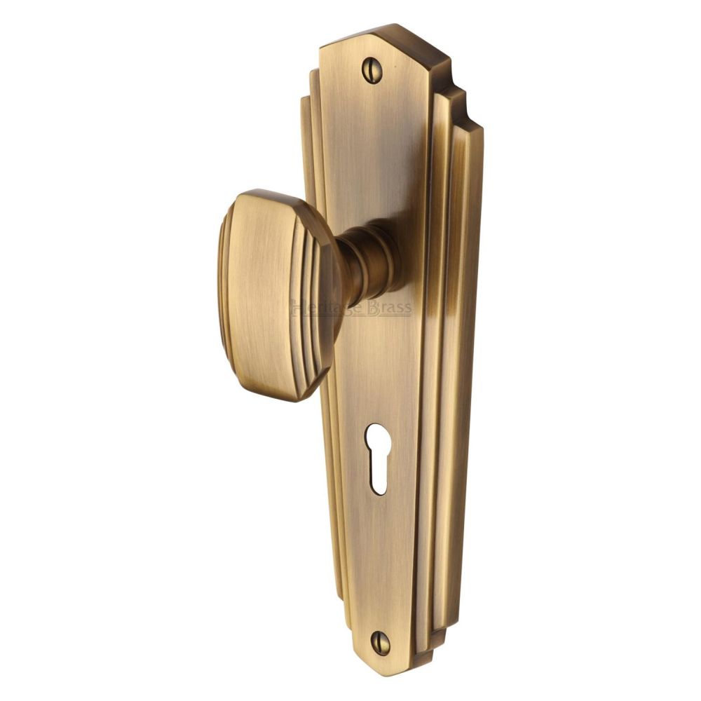 This is an image of a Heritage Brass - Mortice Knob on Lock Plate Charlston Design Antique Brass Finish, cha1900-at that is available to order from T.H Wiggans Ironmongery in Kendal.