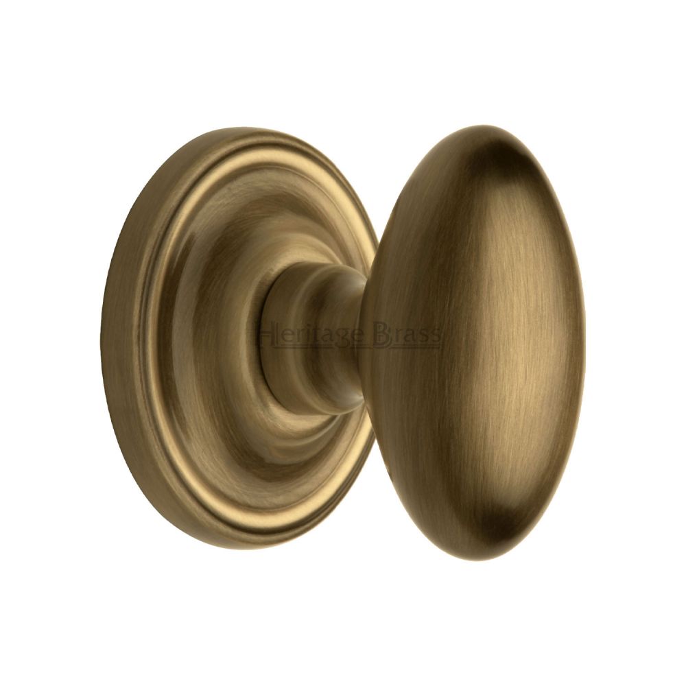 This is an image of a Heritage Brass - Mortice Knob on Rose Chelsea Design Antique Brass Finish, che7373-at that is available to order from T.H Wiggans Ironmongery in Kendal.