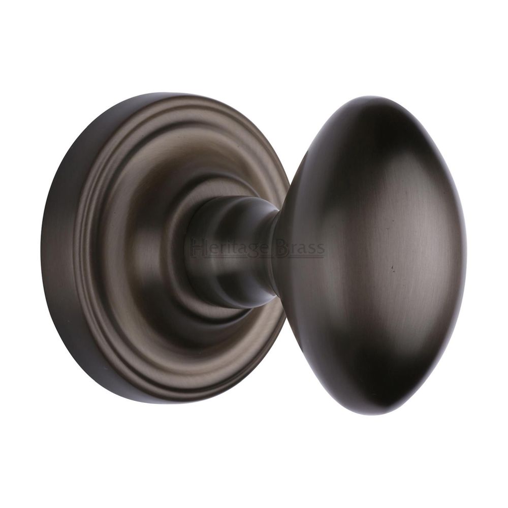 This is an image of a Heritage Brass - Mortice Knob on Rose Chelsea Design Matt Bronze Finish, che7373-mb that is available to order from T.H Wiggans Ironmongery in Kendal.