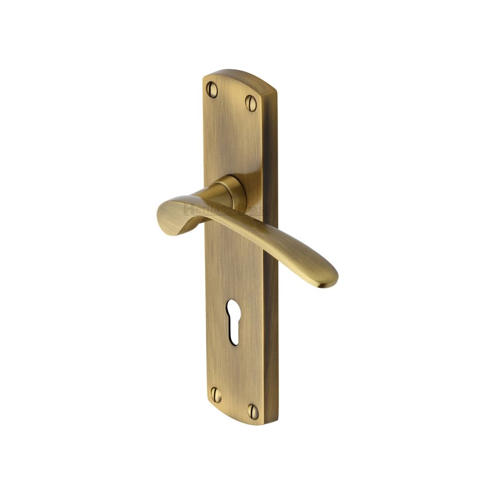 This is an image of a Heritage Brass - Door Handle Lever Lock Diplomat Design Antique Brass Finish, dip7800-at that is available to order from T.H Wiggans Ironmongery in Kendal.