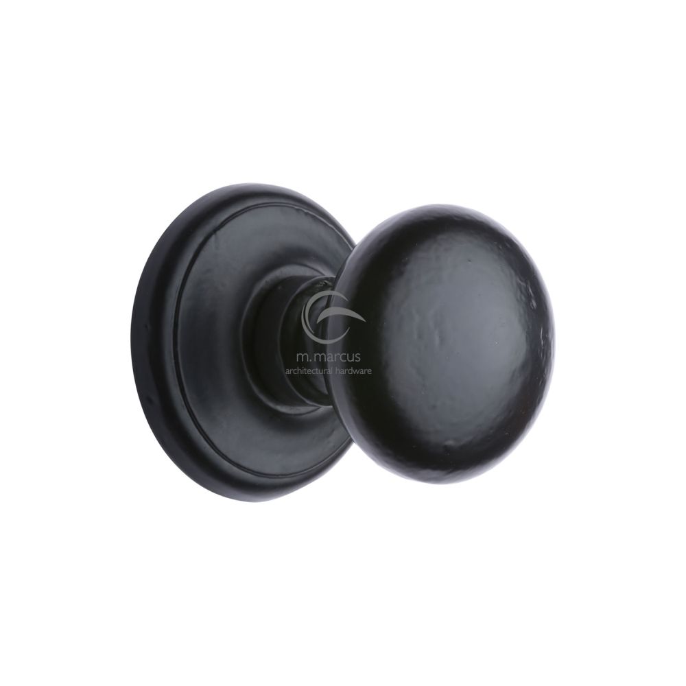 This is an image of a M.Marcus - Black Iron Rustic Round Centre Door Knob 3", fb901 that is available to order from T.H Wiggans Ironmongery in Kendal.
