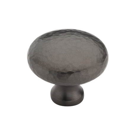 This is an image of a Heritage Brass - Cabinet Knob Victorian Round Hammered Design 38mm Matt Bronze finish, ham113-38-mb that is available to order from T.H Wiggans Ironmongery in Kendal.