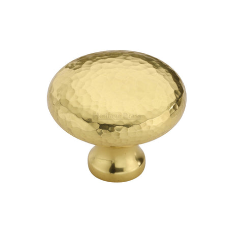 This is an image of a Heritage Brass - Cabinet Knob Victorian Round Hammered Design 38mm Polished Brass finish, ham113-38-pb that is available to order from T.H Wiggans Ironmongery in Kendal.