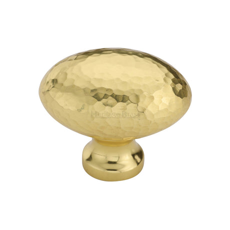 This is an image of a Heritage Brass - Cabinet Knob Victorian Oval Hammered Design 38mm Polished Brass finish, ham114-38-pb that is available to order from T.H Wiggans Ironmongery in Kendal.