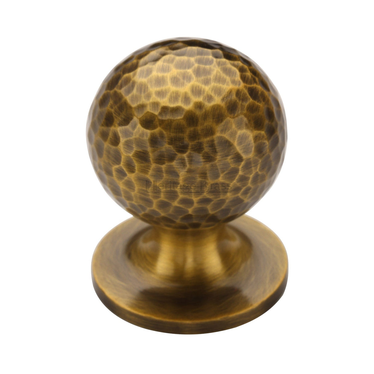 This is an image of a Heritage Brass - Cabinet Knob Ball Hammered Design 32mm Antique Brass finish, ham8321-32-at that is available to order from T.H Wiggans Ironmongery in Kendal.