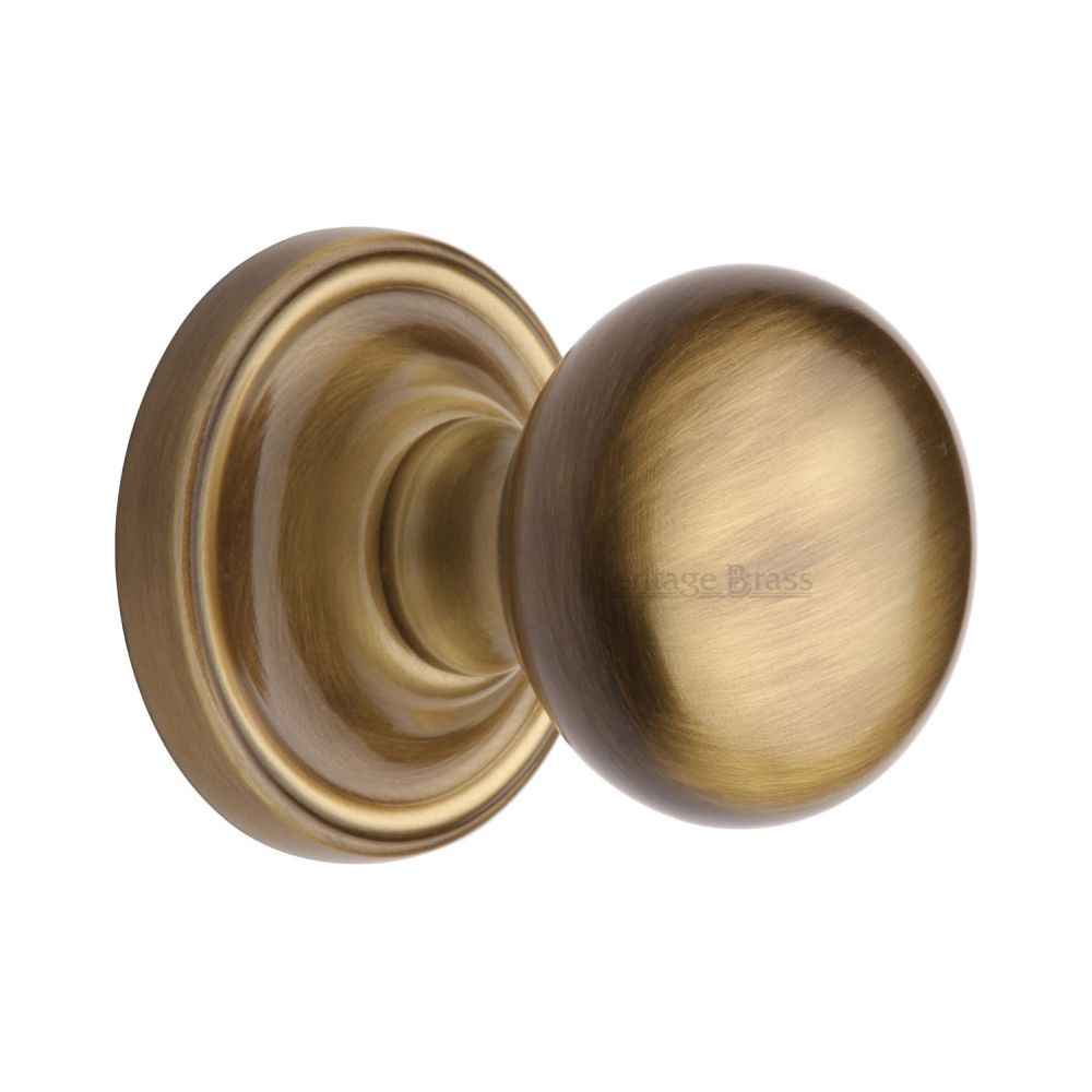 This is an image of a Heritage Brass - Mortice Knob on Rose Hampstead Design Antique Brass Finish, ham8361-at that is available to order from T.H Wiggans Ironmongery in Kendal.