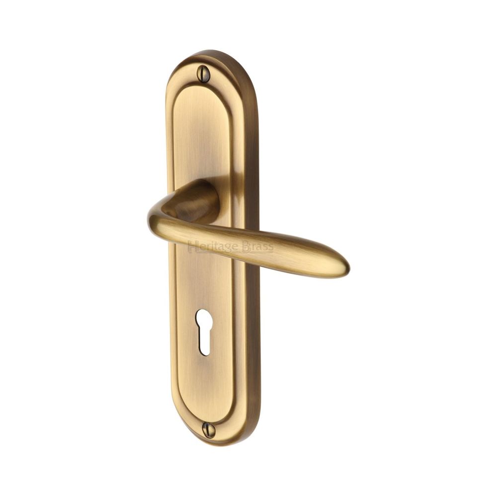 This is an image of a Heritage Brass - Door Handle Lever Lock Henley Design Antique Brass Finish, hen1200-at that is available to order from T.H Wiggans Ironmongery in Kendal.