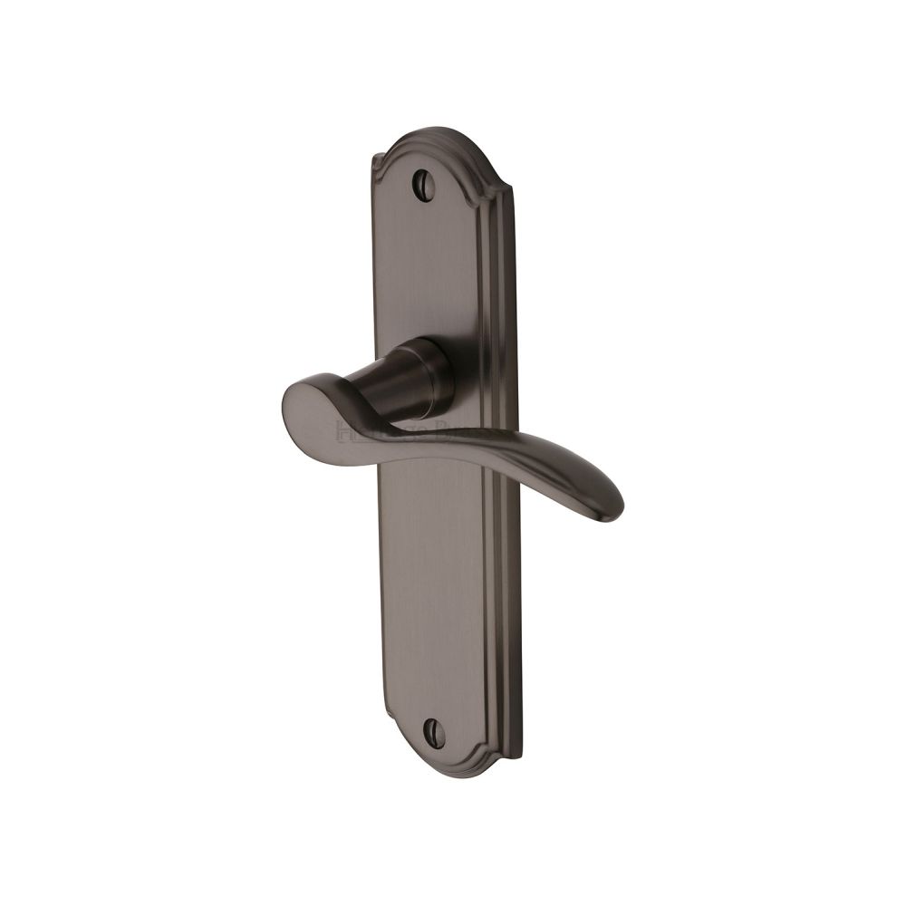 This is an image of a Heritage Brass - Door Handle Lever Latch Howard Design Matt Bronze Finish, how1310-mb that is available to order from T.H Wiggans Ironmongery in Kendal.