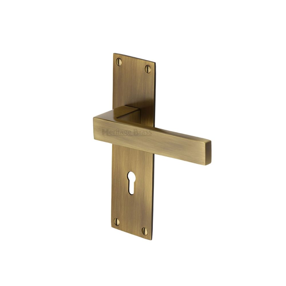 This is an image of a Heritage Brass - Door Handle Lever Lock Metro Design Antique Brass Finish, met4900-at that is available to order from T.H Wiggans Ironmongery in Kendal.