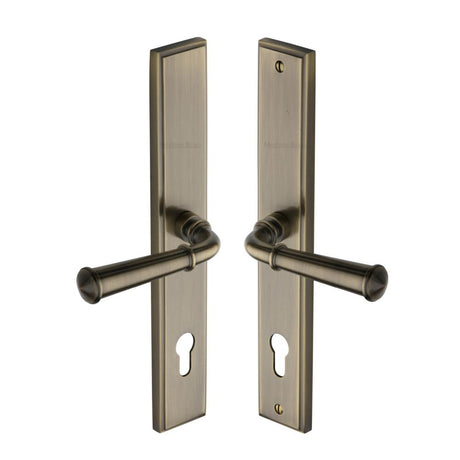This is an image of a Heritage Brass - Multi-Point Door Handle Lever Lock Colonial LH Design Antique Bras, mp1932-lh-at that is available to order from T.H Wiggans Ironmongery in Kendal.