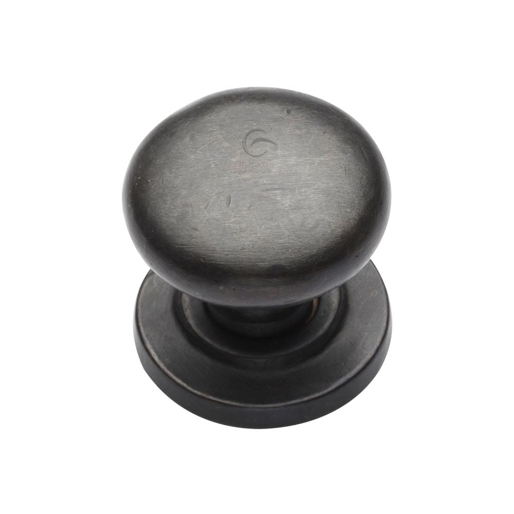 This is an image of a M.Marcus - Rustic Dark Bronze Cabinet Knob Round Design on Rose 38mm, rdb613-38 that is available to order from T.H Wiggans Ironmongery in Kendal.