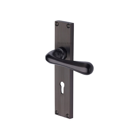 This is an image of a Heritage Brass - Charlbury Reeded Lever Lock Matt Bronze finish, rr3000-mb that is available to order from T.H Wiggans Ironmongery in Kendal.