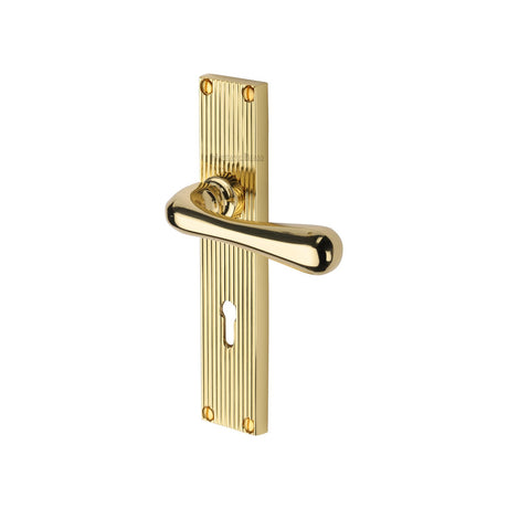 This is an image of a Heritage Brass - Charlbury Reeded Lever Lock Polished Brass finish, rr3000-pb that is available to order from T.H Wiggans Ironmongery in Kendal.