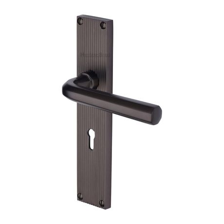 This is an image of a Heritage Brass - Octave Reeded Lever Lock Matt Bronze finish, rr3700-mb that is available to order from T.H Wiggans Ironmongery in Kendal.
